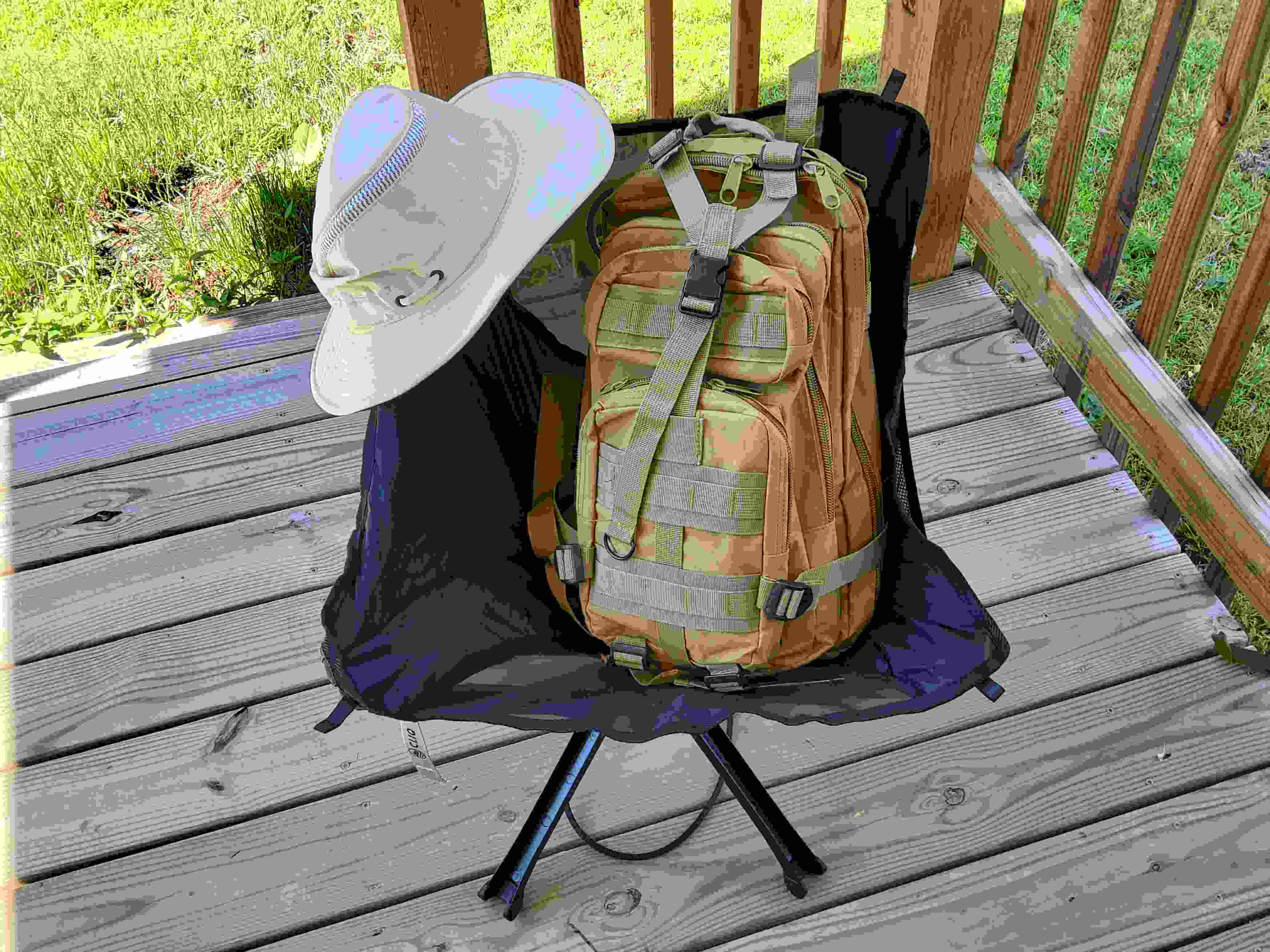 TR-35 ready to go in generic tactical daypack, with folding chair and hat.