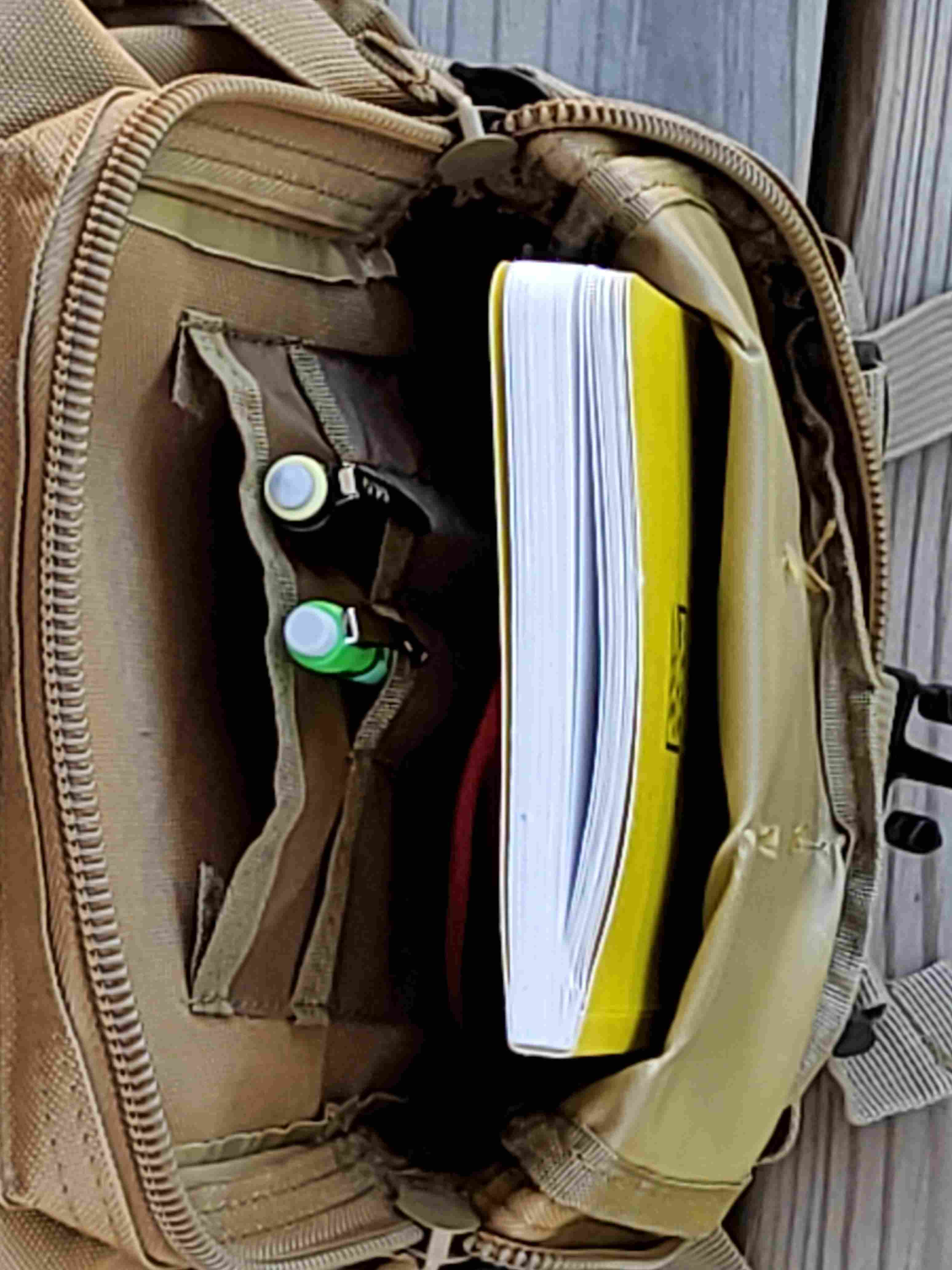Small pocket of tactical daypack, with logbook, pencils, etc.